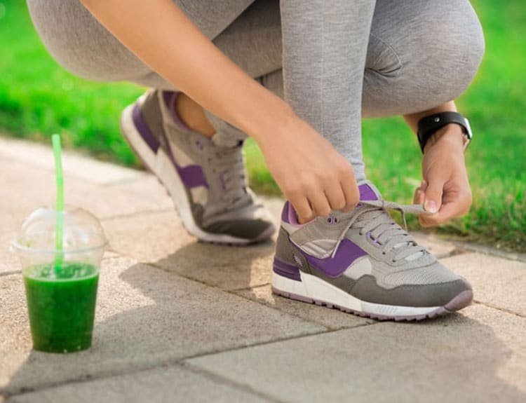 Weght Loss for diabetic putting on running shoes