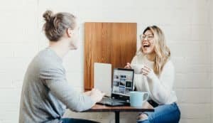 couple coffee together laughing