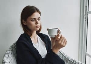 woman with tea cup thinking
