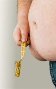 overweight man stomach measuring waist 470h