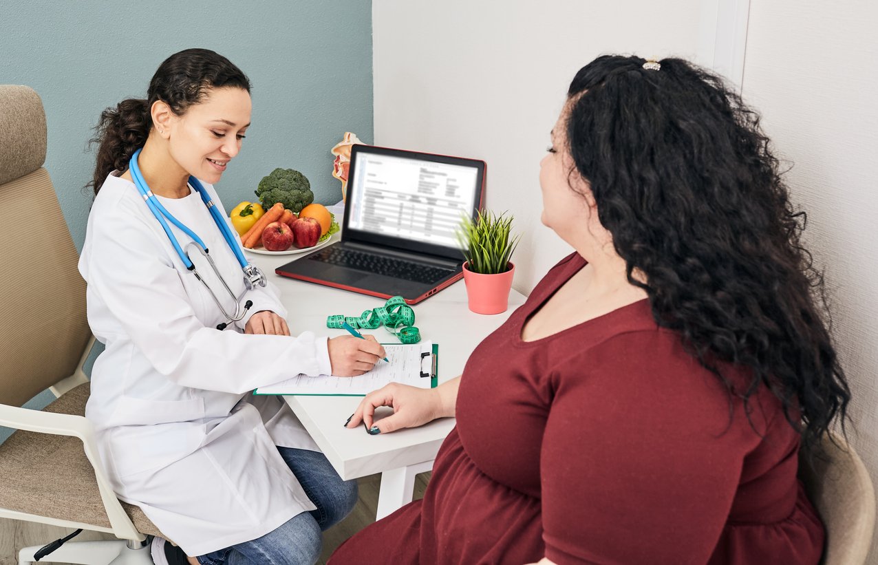 Nutritionist calculating body mass index of fat woman for obesity treatment.